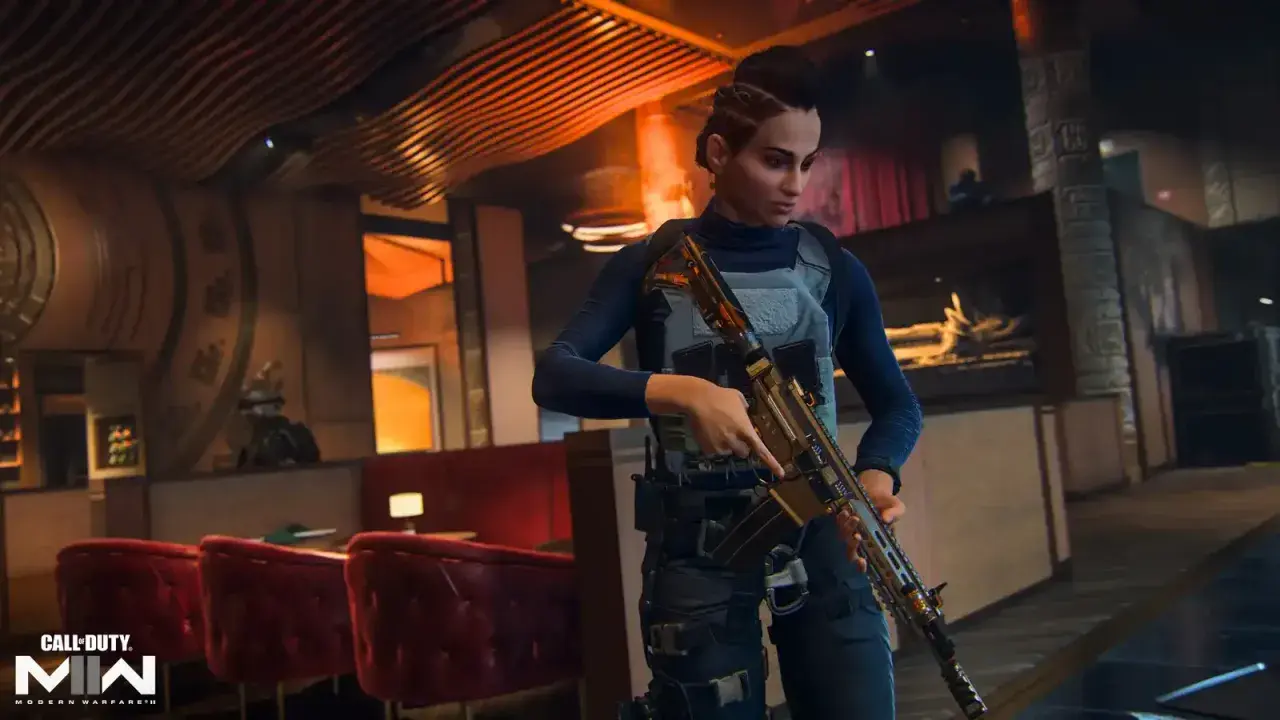 Kobieta z karabinem w ręku, gotowa do akcji w grze Warzone 2. W tle bar i czerwone fotele.