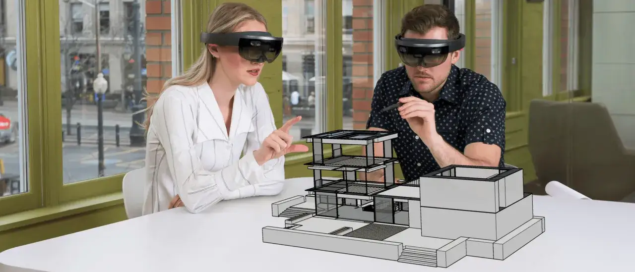 Architekci w goglach VR Tube analizują projekt domu.