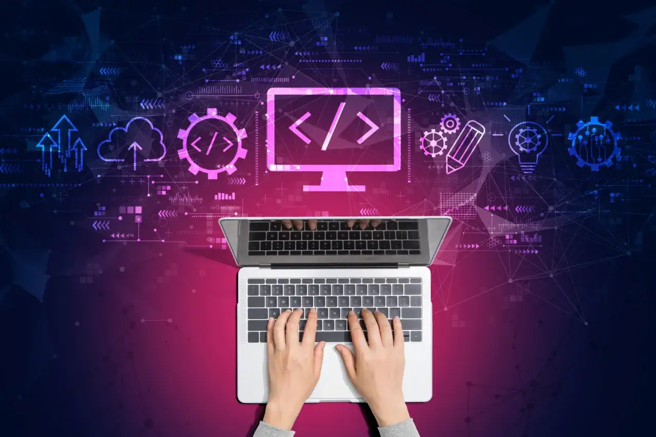 Ręce piszą na laptopie, tworząc grafikę z ikonami symbolizującymi kodowanie i chmurę. Dowiedz się, jak zrobić maila w HTML.